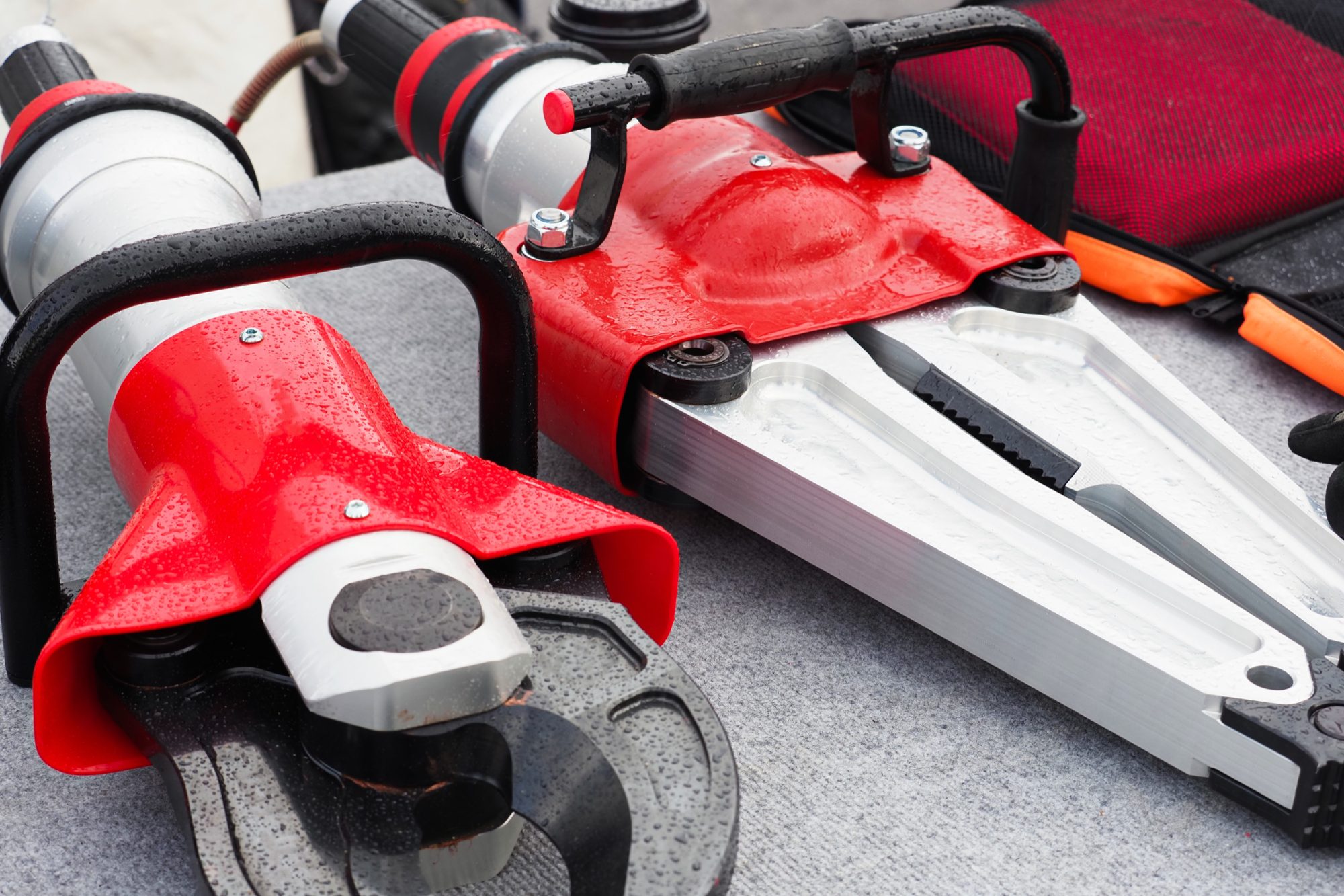 A hydraulic cutter and spreader, the kind of tooling used for safe, chipless cutting of pipe and steel
